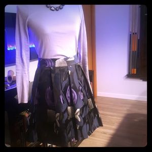 Pleated silk skirt with purple oversized tulips